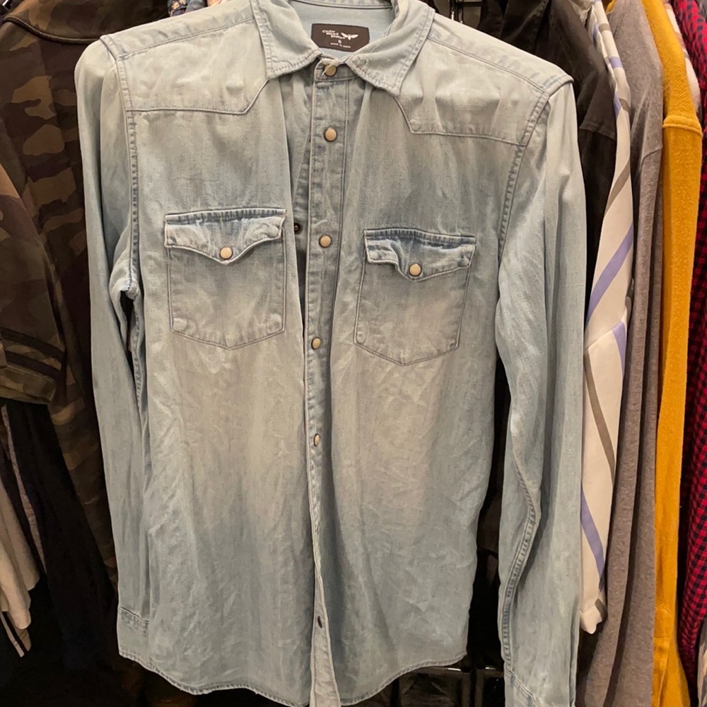 Distressed button down shirt.